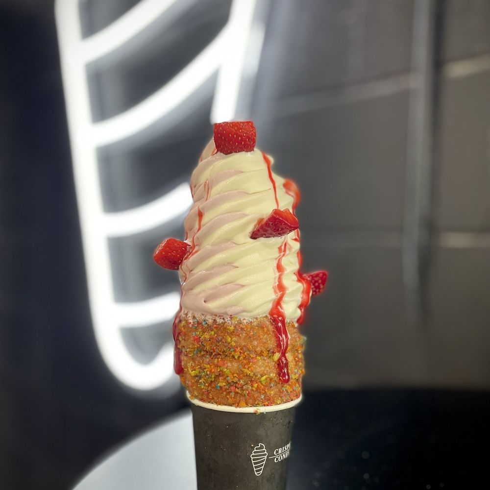 Crispy Cones - Huckleberry swirl with strawberries and raspberry sauce in a Fruity Pebbles cone - Ice Cream & Frozen Yogurt Near Me - Orlando, Florida Crispy Cones - Huckleberry swirl with strawberries and raspberry sauce in a Fruity Pebbles cone - Ice Cream & Frozen Yogurt Near Me - Orlando, Florida