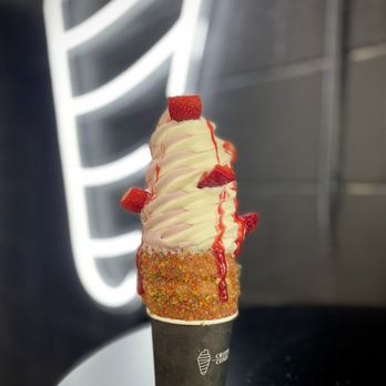 Crispy Cones - Huckleberry swirl with strawberries and raspberry sauce in a Fruity Pebbles cone - Ice Cream & Frozen Yogurt Near Me - Orlando, Florida Crispy Cones - Huckleberry swirl with strawberries and raspberry sauce in a Fruity Pebbles cone - Ice Cream & Frozen Yogurt Near Me - Orlando, Florida