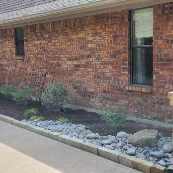 Bloomscapes Design - the front of a brick house - Landscaping Near Me Bloomscapes Design - the front of a brick house - Landscaping Near Me