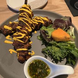 Beef tenderloin appetizers with chimichiri.