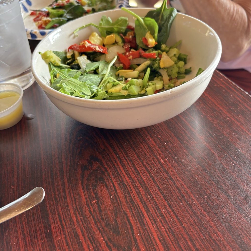 Origin Craft Beer & Pizza Cafe - Origins salad after cheese devoured and portion split - Pizza Near Me - Sarasota, Florida