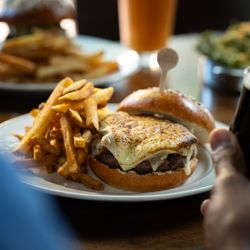 The Capital Burger - Our namesake burger is served French onion-style with caramelized onions, Wisconsin Grand Cru gruyère and shallot aioli.