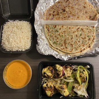 Coriander - Tandoori ginger chicken, onion kulcha, coriander Naan, rice, and Curry sauce - Indian Near Me - Denver, Colorado Coriander - Tandoori ginger chicken, onion kulcha, coriander Naan, rice, and Curry sauce - Indian Near Me - Denver, Colorado