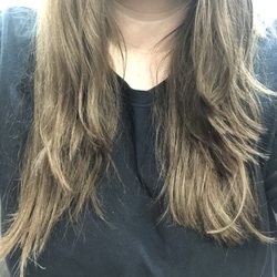 Roma Salon - This was my hair split perfectly down the middle. this is what my "layers" looked like and one side is insanely longet than the other