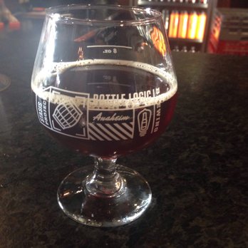 Bottle Logic Brewing - "Stronger than Fiction": a bourbon barrel aged American strong ale with coconut and coldbot coffee beans. - Breweries Near Me - Anaheim, California Bottle Logic Brewing - "Stronger than Fiction": a bourbon barrel aged American strong ale with coconut and coldbot coffee beans. - Breweries Near Me - Anaheim, California