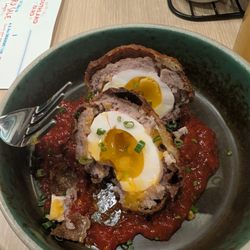 Scotch egg in ketchup