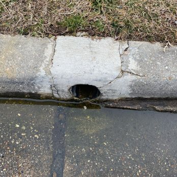 Drainage & Erosion Solutions - Discharge into gutter after installation of drainage system 2/24/21 - Landscaping Near Me - Falls Church, Virginia Drainage & Erosion Solutions - Discharge into gutter after installation of drainage system 2/24/21 - Landscaping Near Me - Falls Church, Virginia