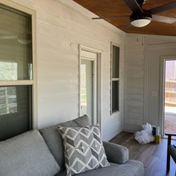 Nice Coat Paintings Services - Staining ceiling and painting interior walls white in sun room of home.