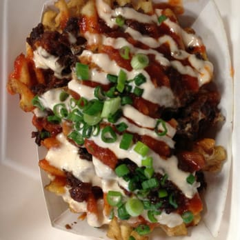 KoJa Kitchen - Fries topped with Korean need, sautéed onions, kimchi, green onions drizzled w red sauce & Japanese mayo! - Asian Fusion Near Me - Berkeley, California