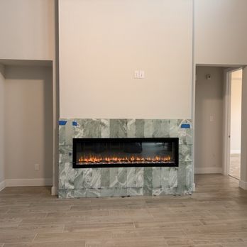 Jc Castillo Tile - Marble electric fireplace surround - Tiling Near Me - Houston, Texas