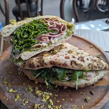 Rosalia Pizza Linden Hills - Crazy twist on a pizza. Basically pizza crust folded into a sandwich with ham arugula burrata. Very tasty! - Pizza Near Me - Minneapolis, Minnesota