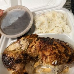 Half chicken with side of white rice and