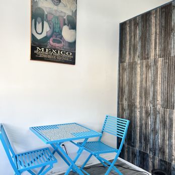 Little Frida's Eatery - a blue table and chairs - Mexican Near Me - The Bronx, New York Little Frida's Eatery - a blue table and chairs - Mexican Near Me - The Bronx, New York