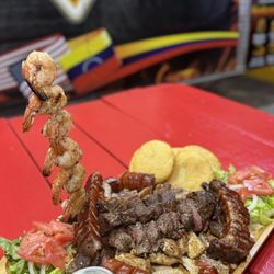 The Point Grill - Grilled Picanha, chicken, ribs, pork and shrimp. With white cheese and salad
