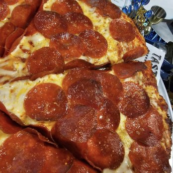 Monkey N' Around Pizza - a slice of pepperoni pizza - Chicken Wings Near Me - Quincy, Washington