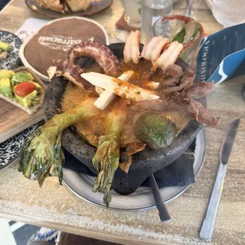 Barracuda - Molcajete with octopus, shrimp, bacon wrapped jalapeño, and other delicious tidbits. - Mexican Near Me - Sayulita, NAY