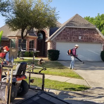 Reliably Fine Lawn Service - a man mowing the lawn - Lawn Services Near Me Reliably Fine Lawn Service - a man mowing the lawn - Lawn Services Near Me