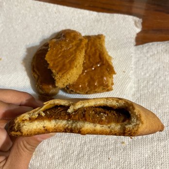 El Paraiso Bakery - a hand holding a half eaten sandwich - Bakeries Near Me - Los Angeles, California