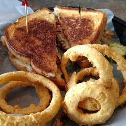 Charlmont Restaurant and Pub - The Vermonter - Grilled Sourdough with real VT roasted turkey, sliced apples, bacon, cheddar cheese, and cranmayo plus homemade onion rings!