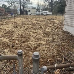 Williams Maintenance & Renovations - This is my yard after they came and placed hay. Uneven, rocky, unsafe!