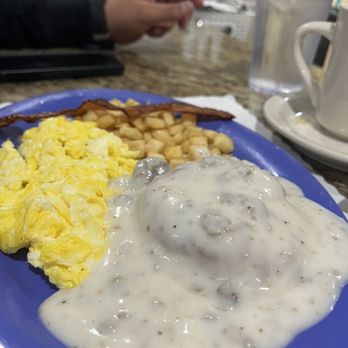 Country Omelette - a blue plate with eggs, sausage, and waffles - Burgers Near Me - Mcallen, Texas Country Omelette - a blue plate with eggs, sausage, and waffles - Burgers Near Me - Mcallen, Texas