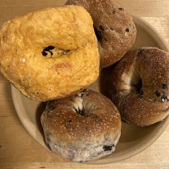 Western Bagel - Only a few left over.  Blueberry, cinnamon and cheese covered.  Yum! - Bagels Near Me - Northridge, California