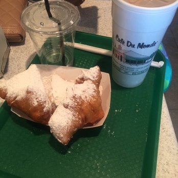 Riverwalk Outlets - Beignets, water chaser and iced cafe au lait at Cafe Du Monde Riverwalk location. - Shopping Centers Near Me - New Orleans, Louisiana Riverwalk Outlets - Beignets, water chaser and iced cafe au lait at Cafe Du Monde Riverwalk location. - Shopping Centers Near Me - New Orleans, Louisiana