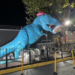 Shell - Putin being eaten by a Trex