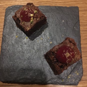 Portfolio restaurant - Compliments of the chef. After dinner, we were given two bite-sized brownies. - Modern European Near Me - Prague, Puerto Rico Portfolio restaurant - Compliments of the chef. After dinner, we were given two bite-sized brownies. - Modern European Near Me - Prague, Puerto Rico