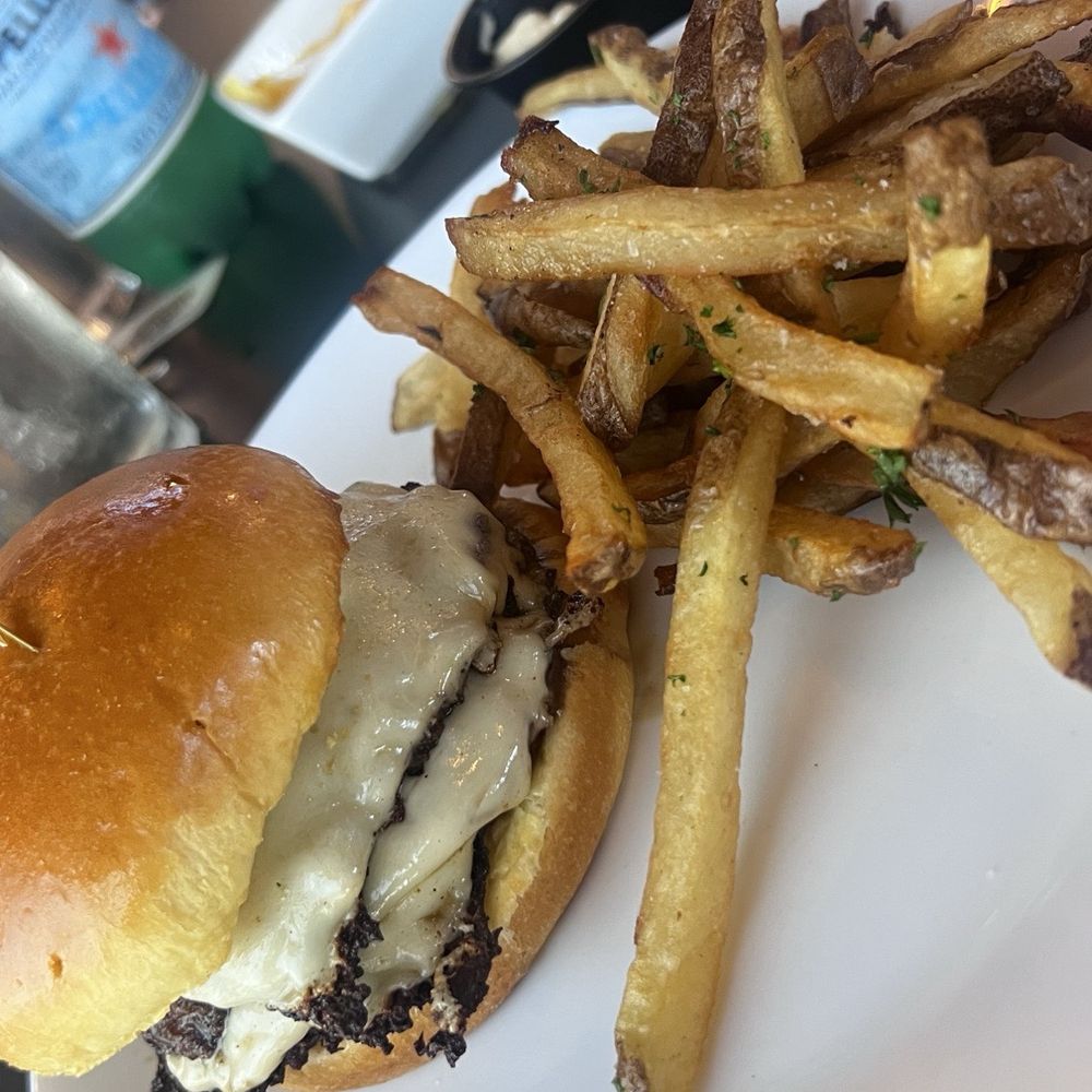 Vine Bistro - " Vine Burger " Double smash burger topped with/ American Cheese & Caramelized onions - Wine Bars Near Me - Ormond Beach, Florida Vine Bistro - " Vine Burger " Double smash burger topped with/ American Cheese & Caramelized onions - Wine Bars Near Me - Ormond Beach, Florida