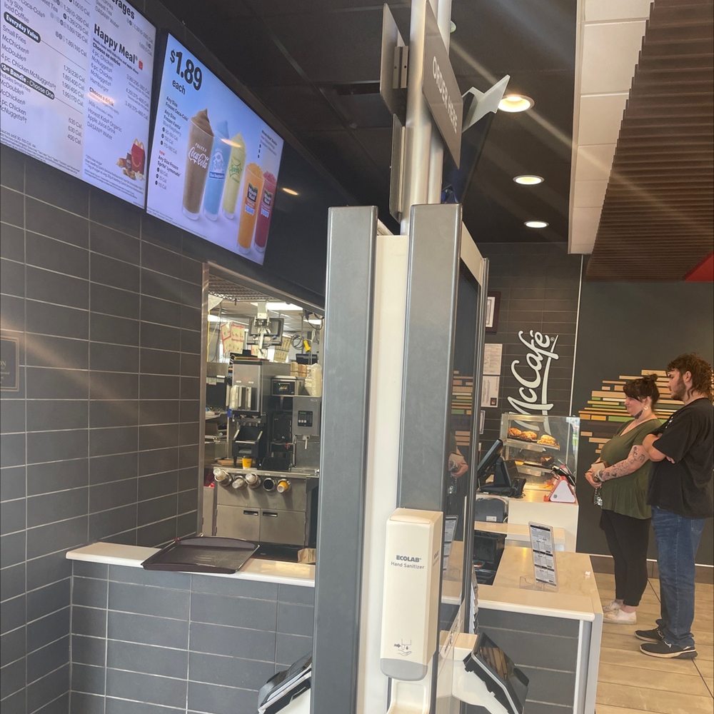 a woman ordering food at the counter a woman ordering food at the counter