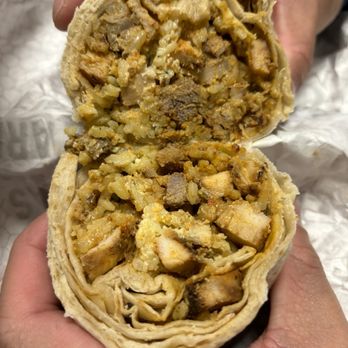Pancheros Mexican Grill - a person holding a burrito - Mexican Near Me - Wall Township, New Jersey Pancheros Mexican Grill - a person holding a burrito - Mexican Near Me - Wall Township, New Jersey