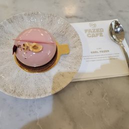 Geisha - a hazelnut cream dome sitting on a chocolate wafer