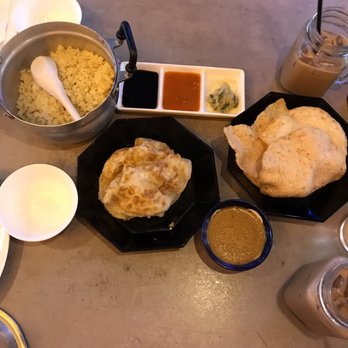 Phat Eatery - Roti Canai, complementary shrimp crackers, yellow rice from hainan chicken - Malaysian Near Me - Katy, Texas Phat Eatery - Roti Canai, complementary shrimp crackers, yellow rice from hainan chicken - Malaysian Near Me - Katy, Texas