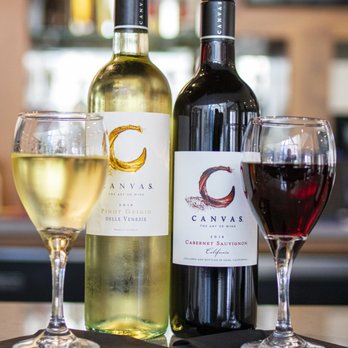 Corso Restaurant - three bottles of wine and two glasses of wine - Pizza Near Me - Rochester, New York
