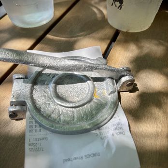 Funcho's - Cute way to deliver the check, in a tortilla press. - Mexican Near Me - Riverhead, New York