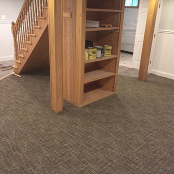 Mass Floors - a room with a bookcase and stairs - Flooring Near Me - Chelsea, Massachusetts Mass Floors - a room with a bookcase and stairs - Flooring Near Me - Chelsea, Massachusetts