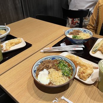 Marugame Udon - Left and top are regular Nikutama. Bottom is the Curry Nikutama. All have tempura and green matcha tea latte - Japanese Near Me - Arcadia, California Marugame Udon - Left and top are regular Nikutama. Bottom is the Curry Nikutama. All have tempura and green matcha tea latte - Japanese Near Me - Arcadia, California