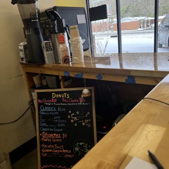 Dough House - The sign shows what they usually have available right behind the serving counter. - Donuts Near Me - Black Mountain, North Carolina