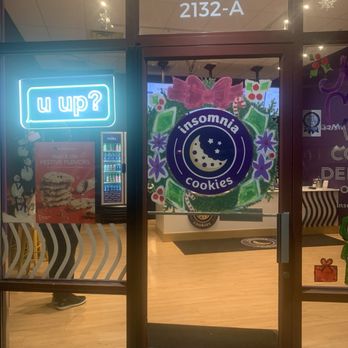 Insomnia Cookies - cute christmas decor on the door in december - Desserts Near Me - Albuquerque, New Mexico