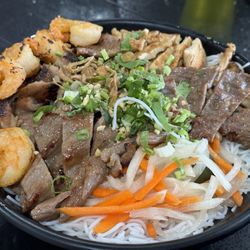 H Pho Asian Bistro - Combination noodle bowl. Doesn't come with egg rolls. Meat could be seasoned more. Nice cook on items. Iceberg again :/