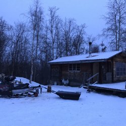 Tolovana Hot Springs - Snow machine outside cabin