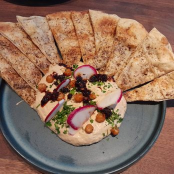 Yard House - Spicy Zatar Hummus. Those little fried chickpeas on top were so light and crunchy. This was very good as well. - American Near Me - Sparks, Nevada