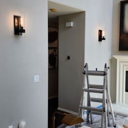 Service Calls Electric - Installed 2 sconces. New wiring behind the wall but avoided creating wall openings.
