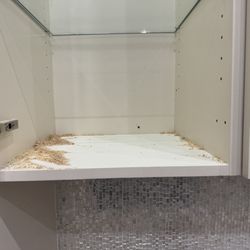 The Kitchen & Bath Showroom - More holes on back of cabinet