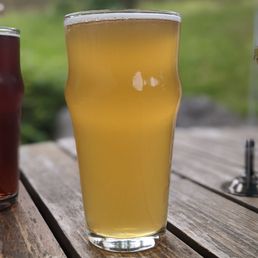 two beers on a picnic table two beers on a picnic table