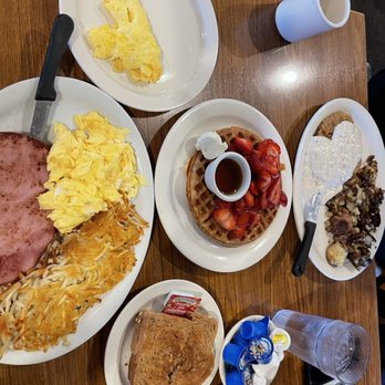 Red Apple Cafe - Waffles with strawberries, country, potatoes, hashbrowns, scrambled eggs, toast, country fried steak with gravy, and coffee. - Breakfast & Brunch Near Me - Fresno, California