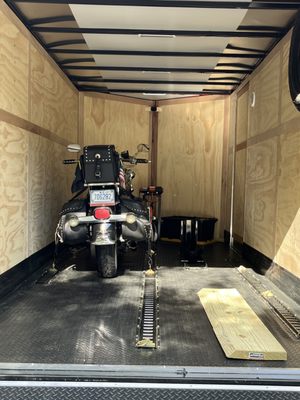 Our 2 Slot Trailer - Our trailer is custom made and can fit 2 motorcycles at once. We can also fit some 4 wheelers and other small all terrain vehicles. We have a E-Track System throughout the trailer, consisting of led lights, and more importantly I have cameras when towing at all times. Give us a call or text today for immediate service! Our 2 Slot Trailer - Our trailer is custom made and can fit 2 motorcycles at once. We can also fit some 4 wheelers and other small all terrain vehicles. We have a E-Track System throughout the trailer, consisting of led lights, and more importantly I have cameras when towing at all times. Give us a call or text today for immediate service!