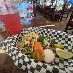 Shrimp taco, carnitas taco and watermelon aqua fresca.
