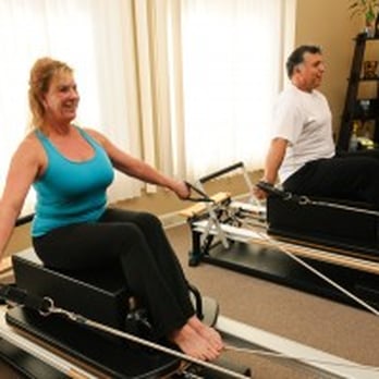 Om Sweet Om Pilates Center - Teri and Patrick working out on the reformer! - Pilates Near Me - Upland, California Om Sweet Om Pilates Center - Teri and Patrick working out on the reformer! - Pilates Near Me - Upland, California